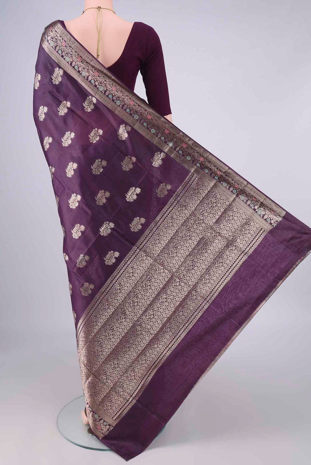 Flat view of Purple Banarasi Tussar Saree with Zari And Thread Butta on the body and Zari Border. 