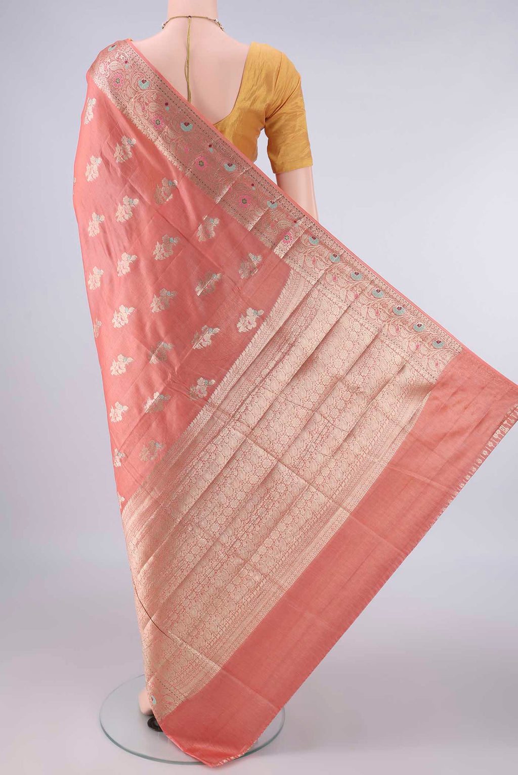 Flat view of Peach Banarasi Tussar Saree with Zari And Thread Butta on the body and Zari Border. 