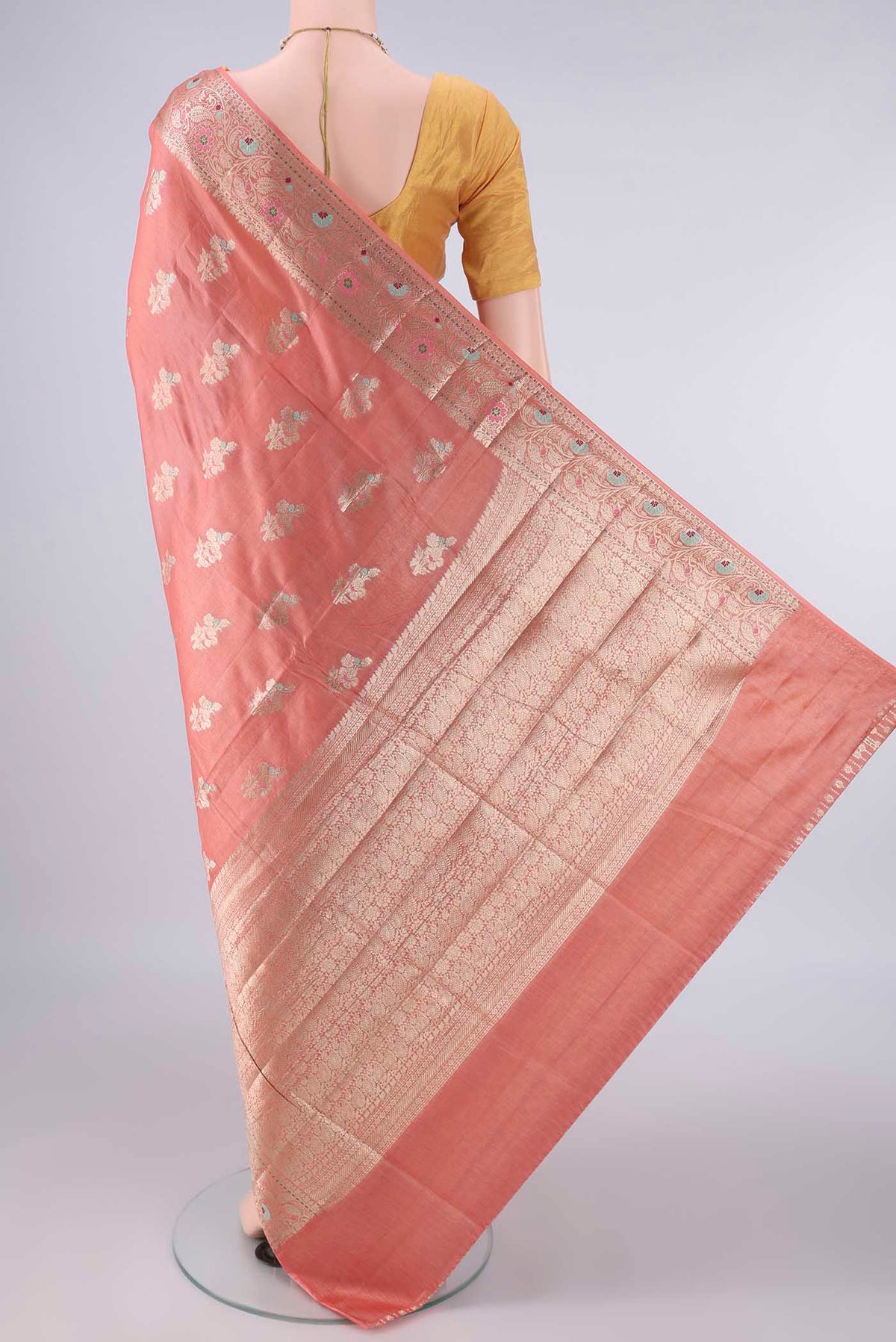 Flat view of Peach Banarasi Tussar Saree with Zari And Thread Butta on the body and Zari Border. 