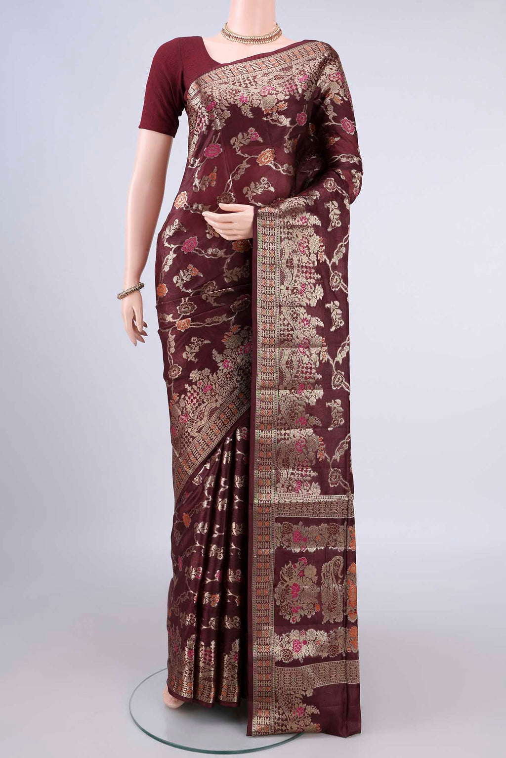 Coffee Brown Banarasi Tussar Saree with Zari And Thread Butta on the body and Zari Border.  displayed on a mannequin