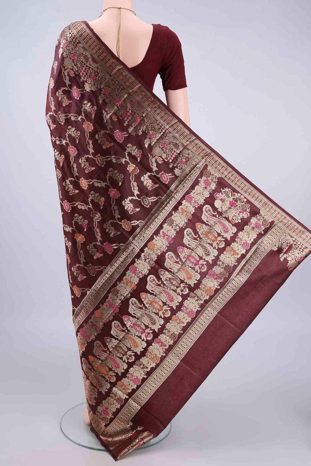 Flat view of Coffee Brown Banarasi Tussar Saree with Zari And Thread Butta on the body and Zari Border. 