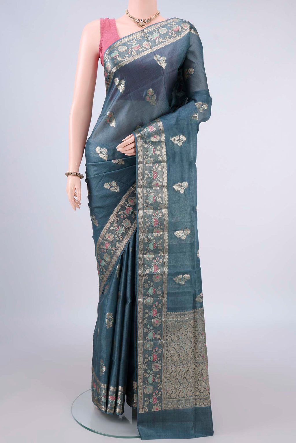 Blue Grey Banarasi Tussar Saree with Zari And Thread Butta on the body and Zari Border.  displayed on a mannequin