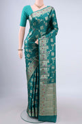 Sea Green Banarasi Tussar Saree with Zari And Thread Butta on the body and Zari Border.  displayed on a mannequin