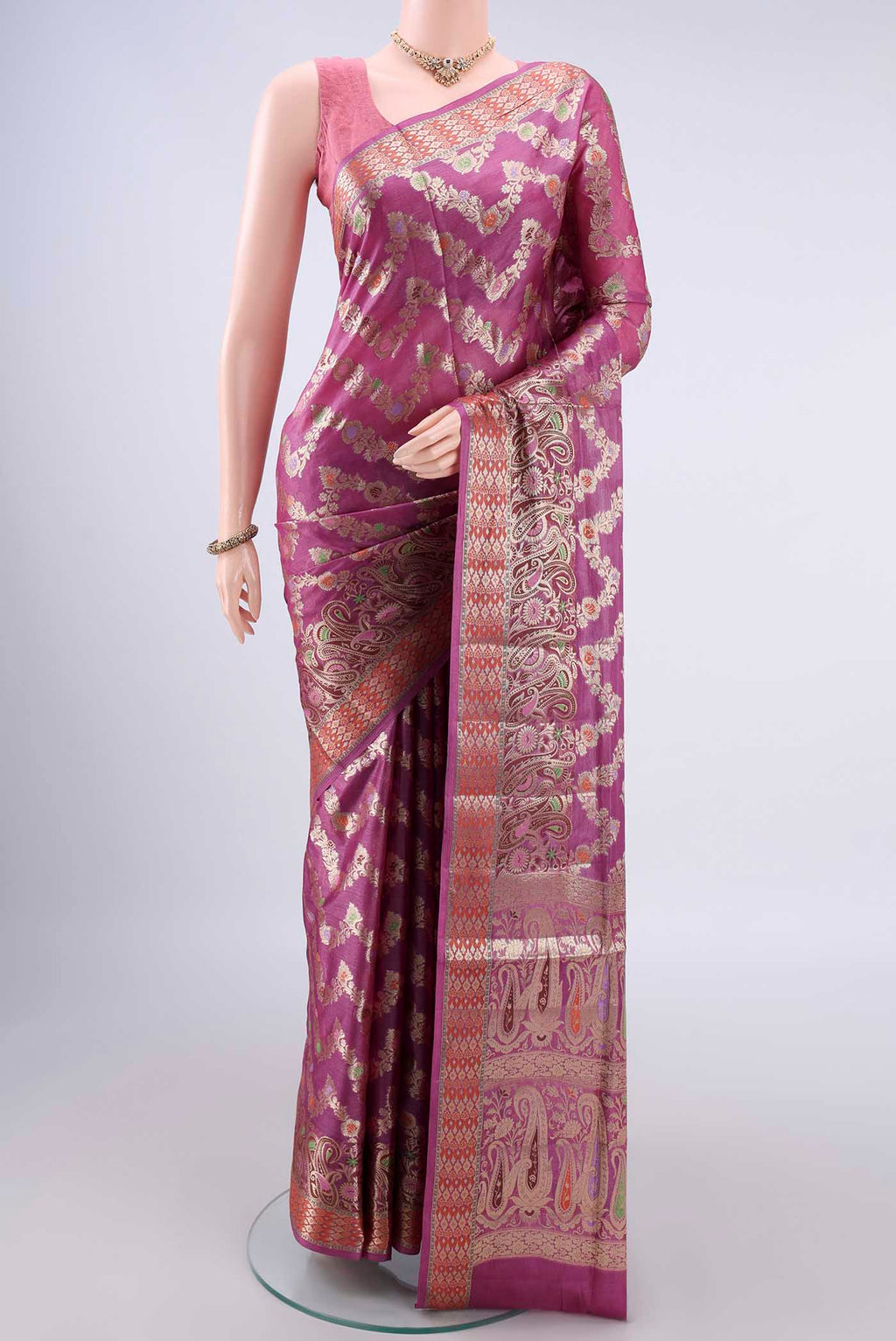 Pink Banarasi Tussar Saree with Zari And Thread Butta on the body and Zari Border.  displayed on a mannequin