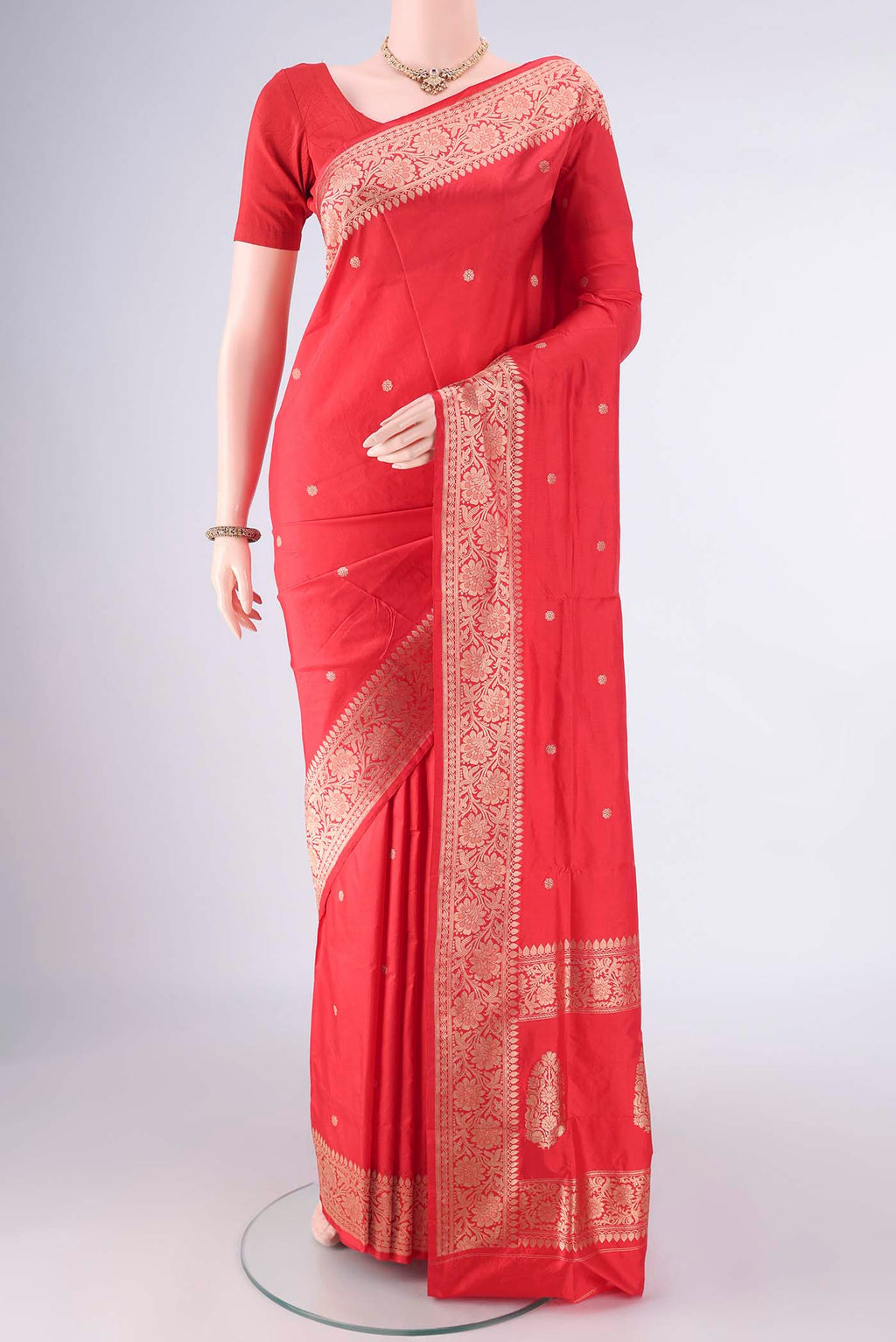 Pure Silk Red Banarasi Katan Saree with Zari Butta on the body and Zari Border.  displayed on a mannequin