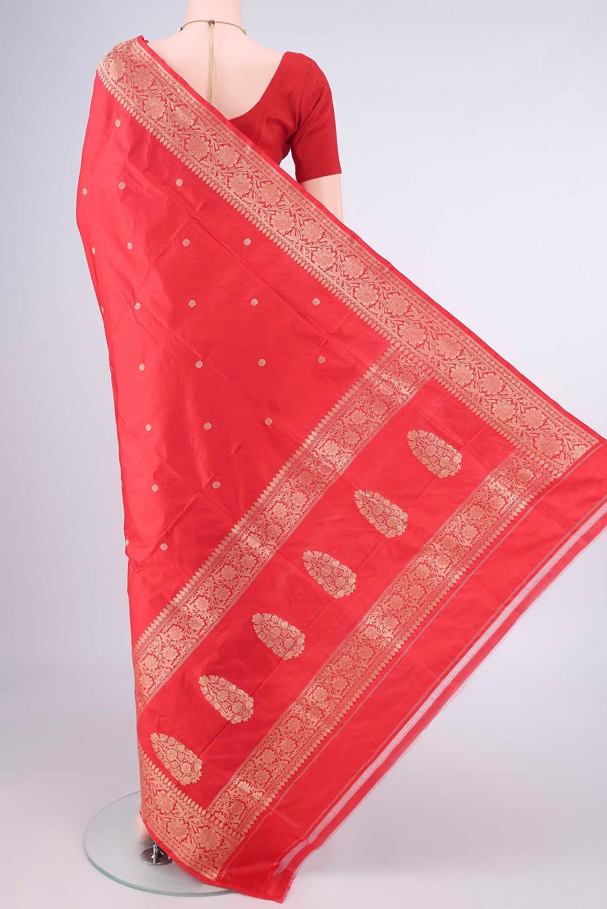 Flat view of Pure Silk Red Banarasi Katan Saree with Zari Butta on the body and Zari Border. 