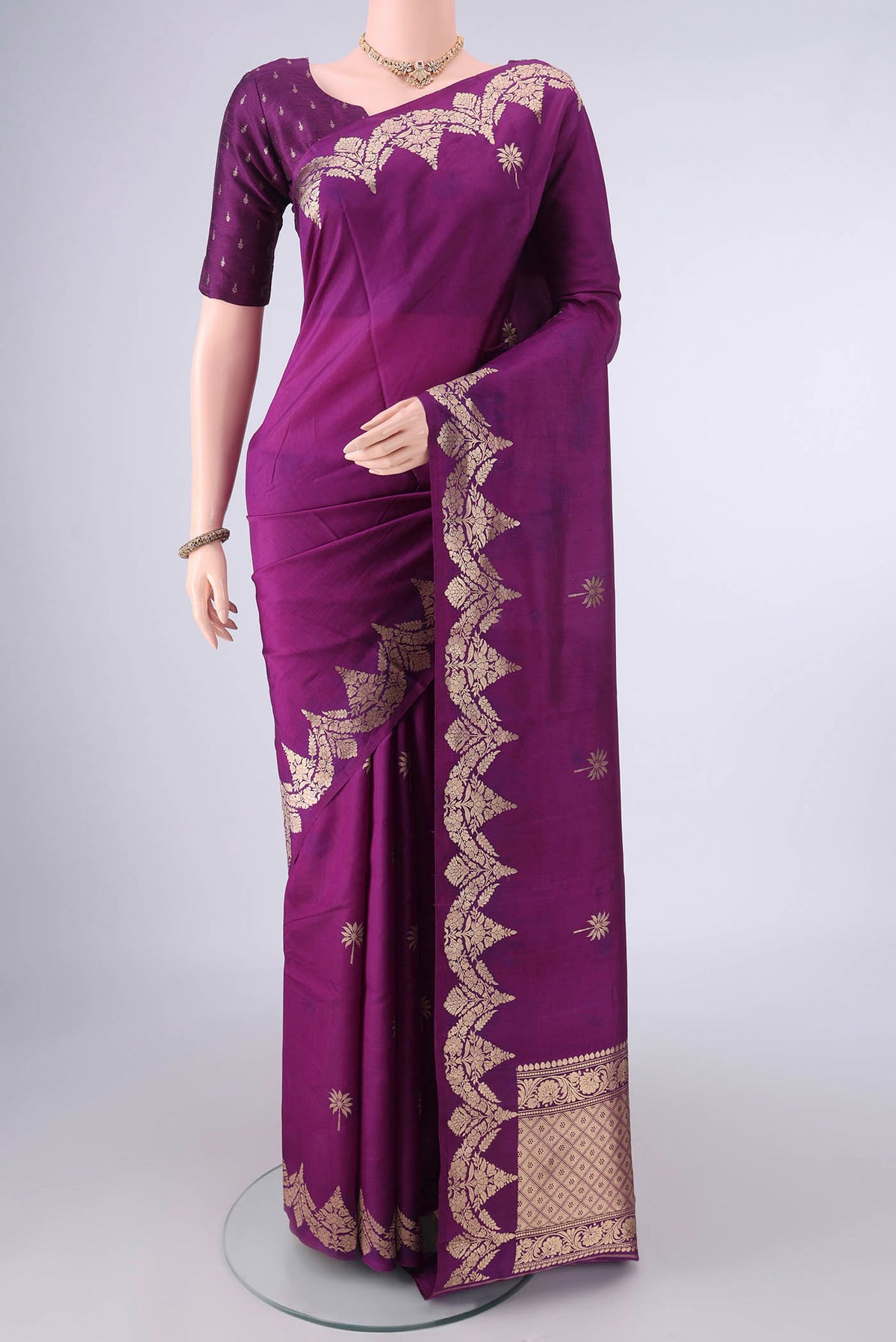 Pure Silk Purple Banarasi Katan Saree with Zari Butta on the body and Zari Border.  displayed on a mannequin