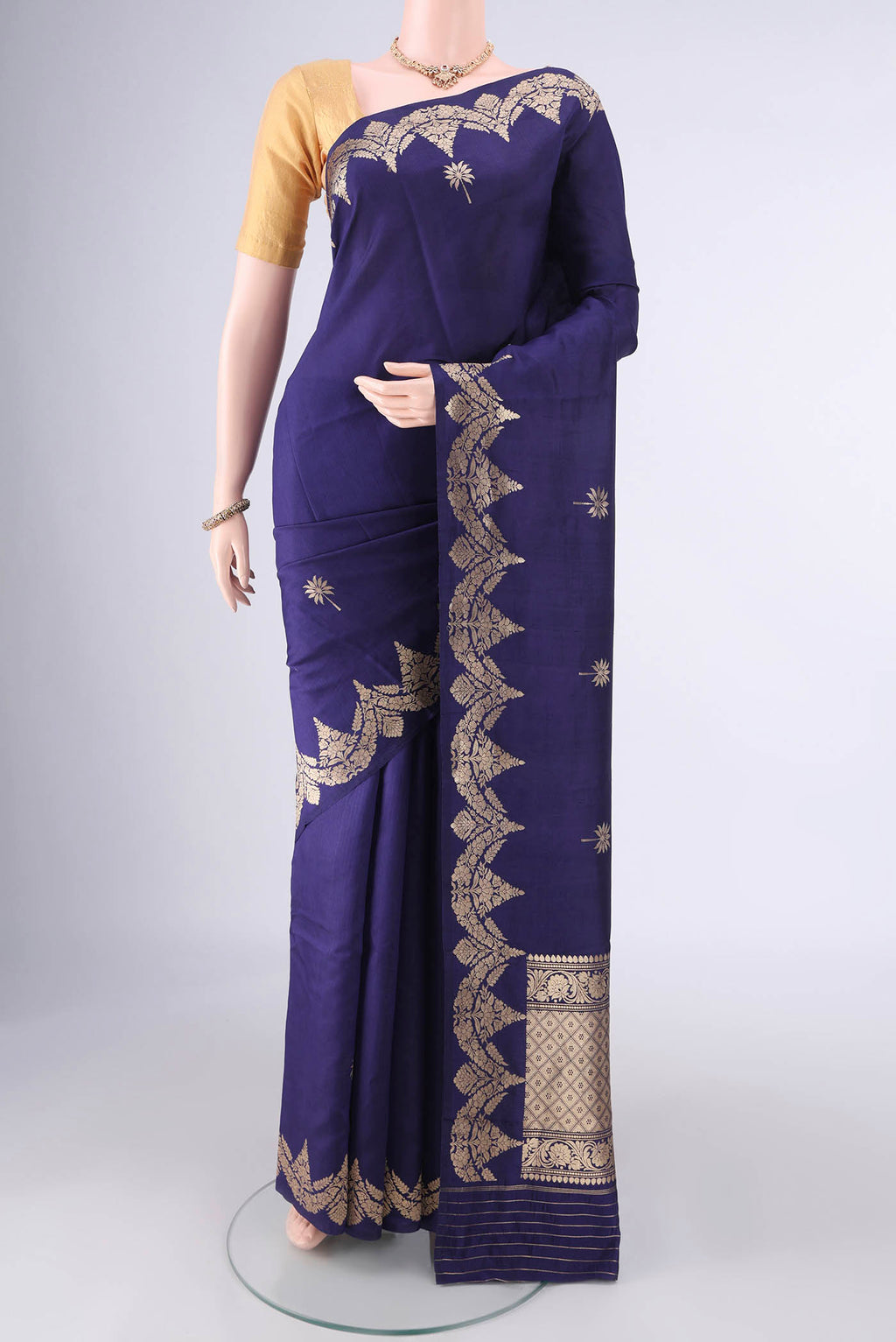 Pure Silk Navy Blue Banarasi Katan Saree with Zari Butta on the body and Fancy Border.  displayed on a mannequin