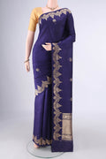 Pure Silk Navy Blue Banarasi Katan Saree with Zari Butta on the body and Fancy Border.  displayed on a mannequin
