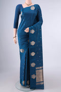 Pure Silk Blue Banarasi Katan Saree with Zari Butta on the body and Satin Border.  displayed on a mannequin