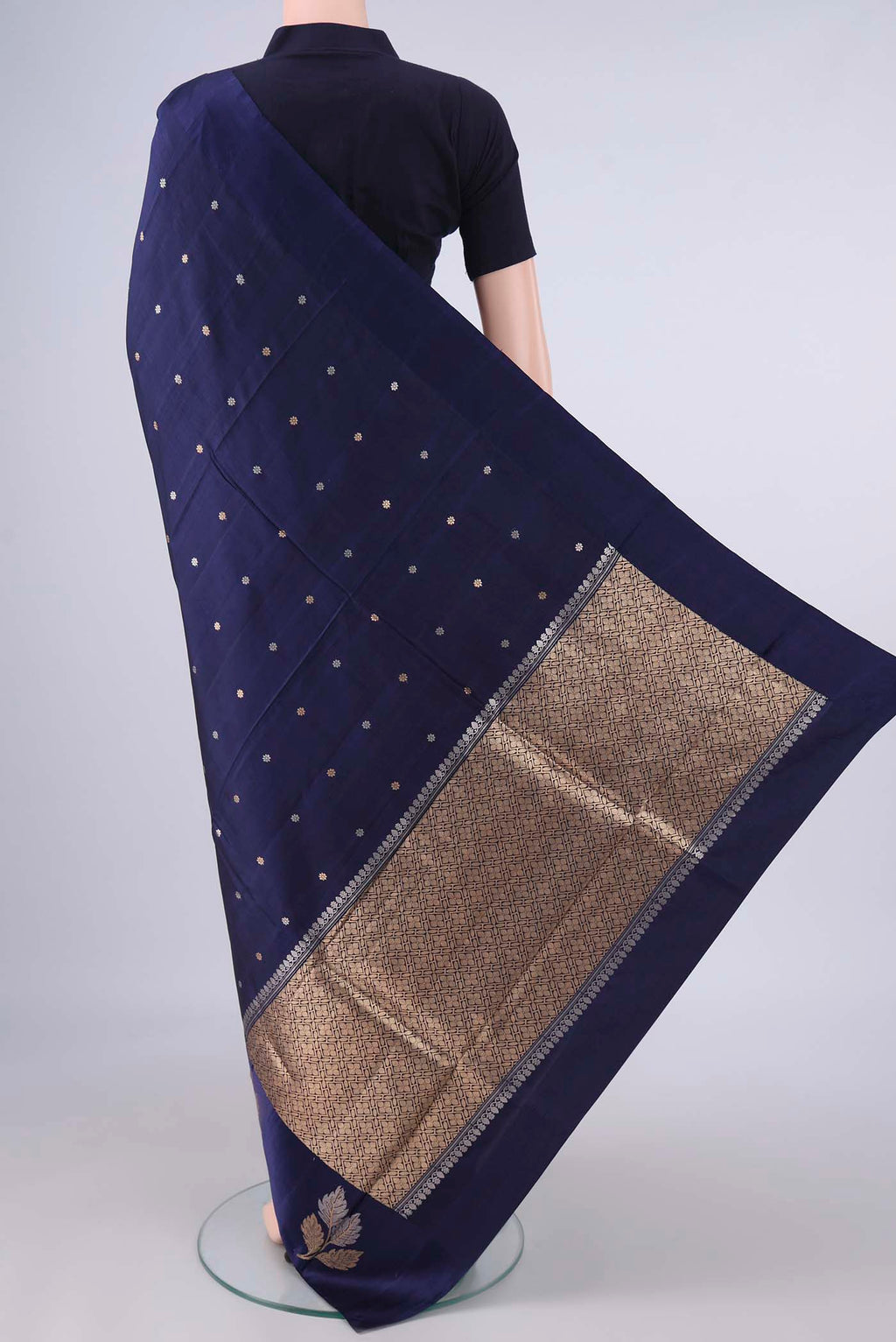 Flat view of Pure Silk Navy Blue Banarasi Katan Saree with Zari Butta on the body and Satin Border. 