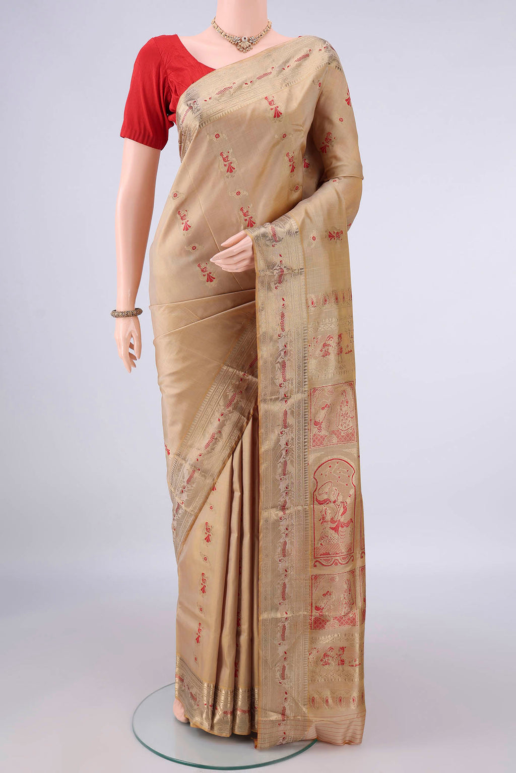 Pure Silk Dark Beige Baluchari Saree with Zari And Thread Butta on the body and Zari Border.  displayed on a mannequin