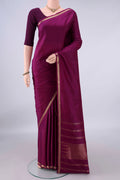 Pure Silk Magenta Kanjivaram Saree with Plain Body and Zari Border.  displayed on a mannequin