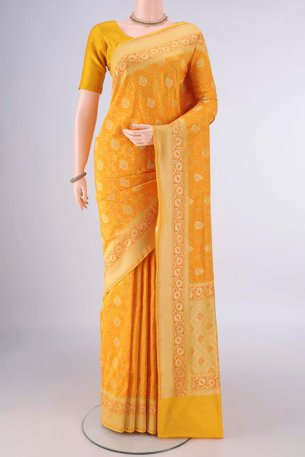 Pure Silk Yellow Banarasi Saree with Jacquard With Thread Butta on the body and Zari And Thread Border.  displayed on a mannequin