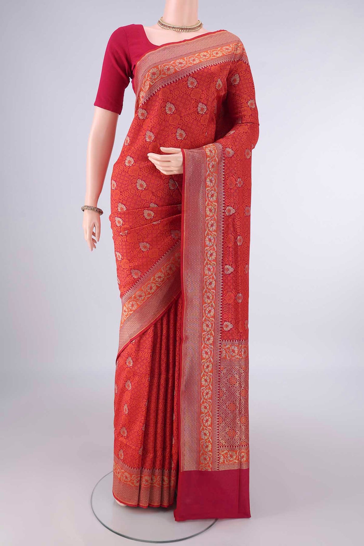 Pure Silk Red Banarasi Saree with Jacquard With Zari Butta on the body and Zari And Thread Border.  displayed on a mannequin