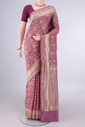 Pure Silk Pink Banarasi Saree with Jacquard With Thread Butta on the body and Zari And Thread Border.  displayed on a mannequin