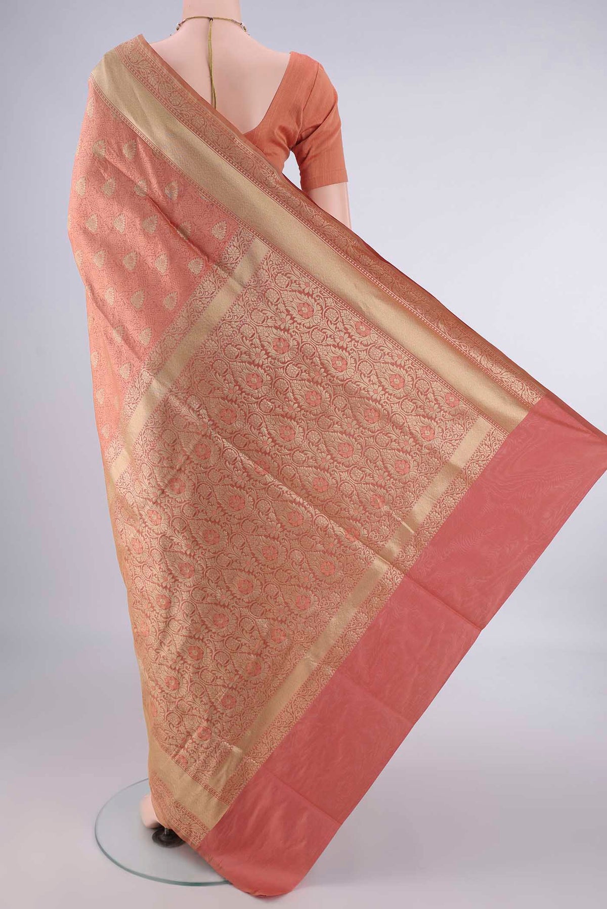 Flat view of Pure Silk Peach Banarasi Saree with Jacquard With Zari Butta on the body and Zari And Thread Border. 