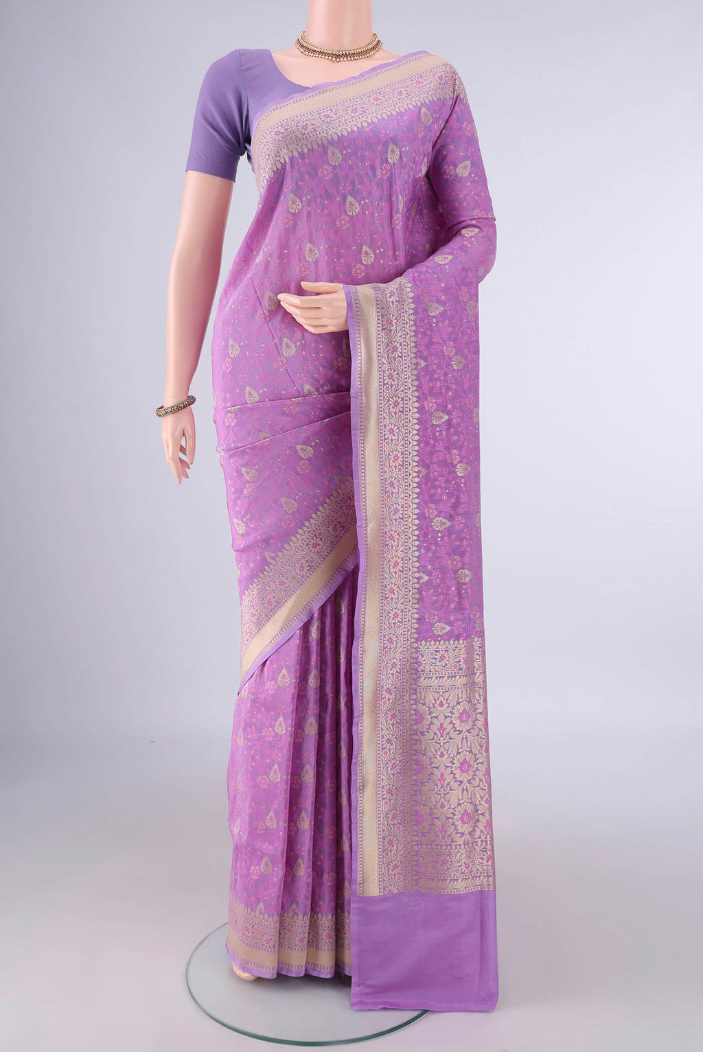 Pure Silk Lavender Banarasi Saree with Jacquard With Zari Butta on the body and Zari And Thread Border.  displayed on a mannequin