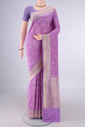 Pure Silk Lavender Banarasi Saree with Jacquard With Zari Butta on the body and Zari And Thread Border.  displayed on a mannequin