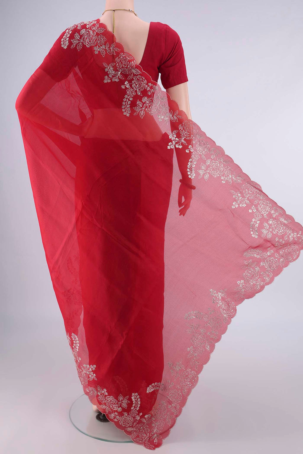 Flat view of Deep Red Organza Saree with Plain Body and Embroidery Border. 
