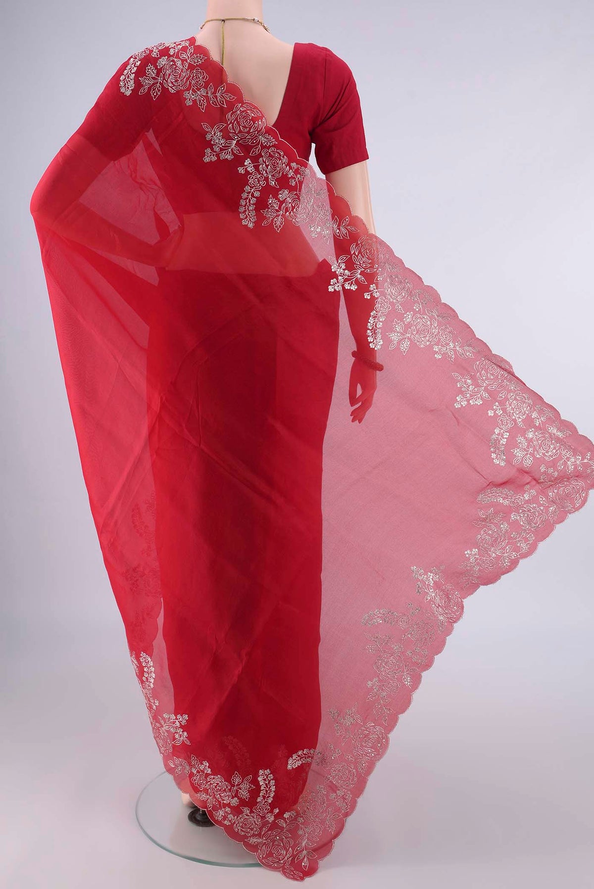Flat view of Deep Red Organza Saree with Plain Body and Embroidery Border. 