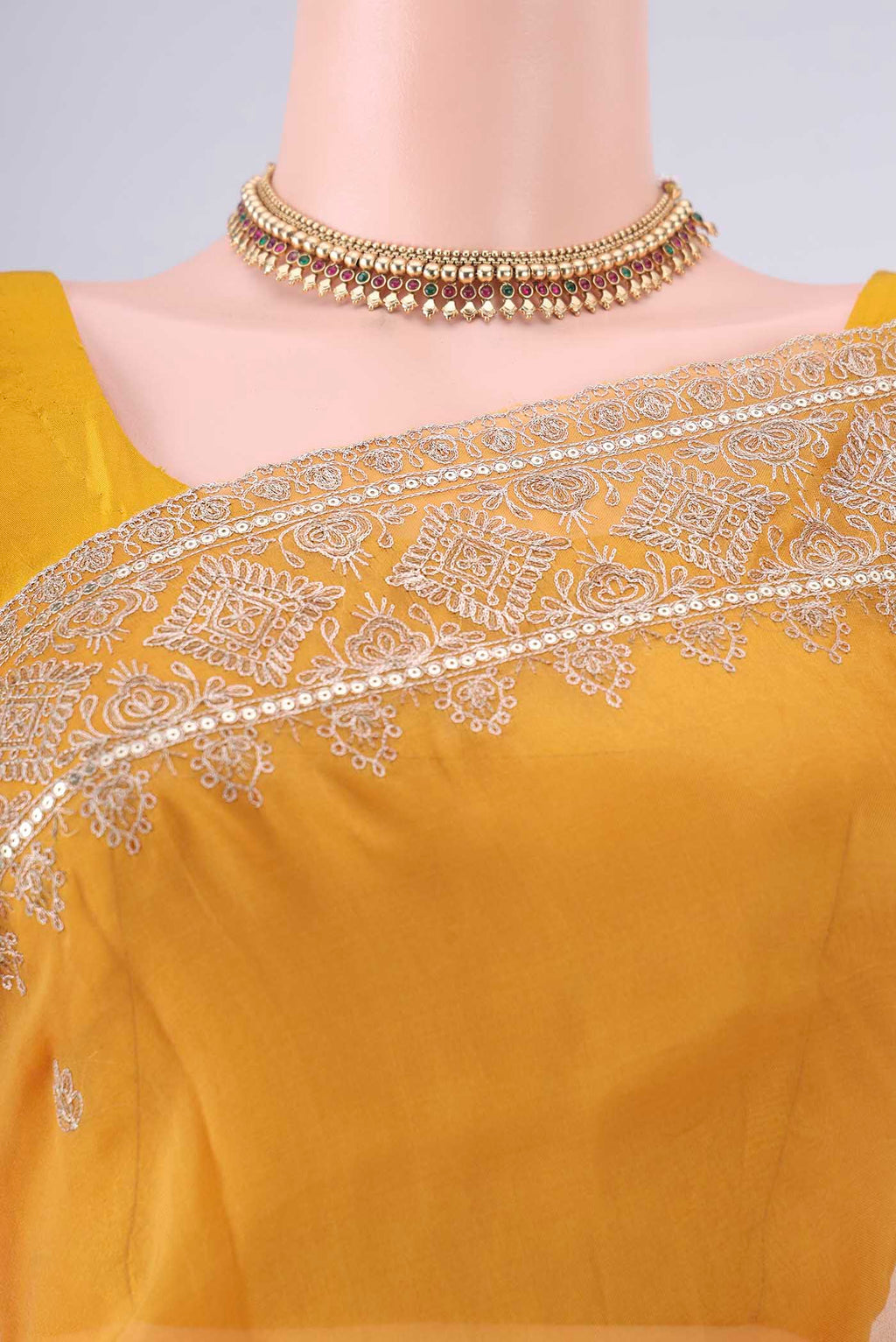 Border image of Yellow Organza Saree with Embroidery on the body and Embroidery Border. 