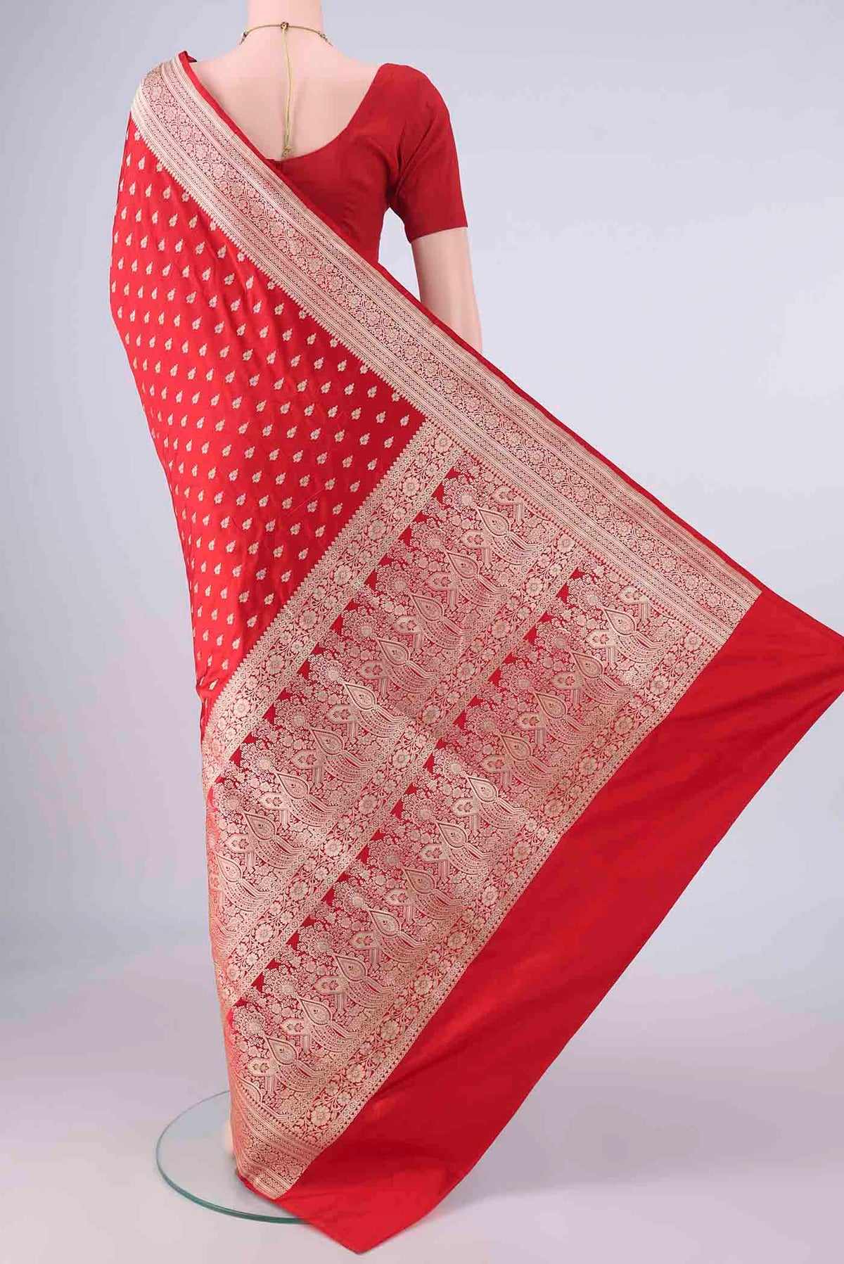 Flat view of Pure Silk Red Banarasi Saree with Zari Butta on the body and Zari Border. 