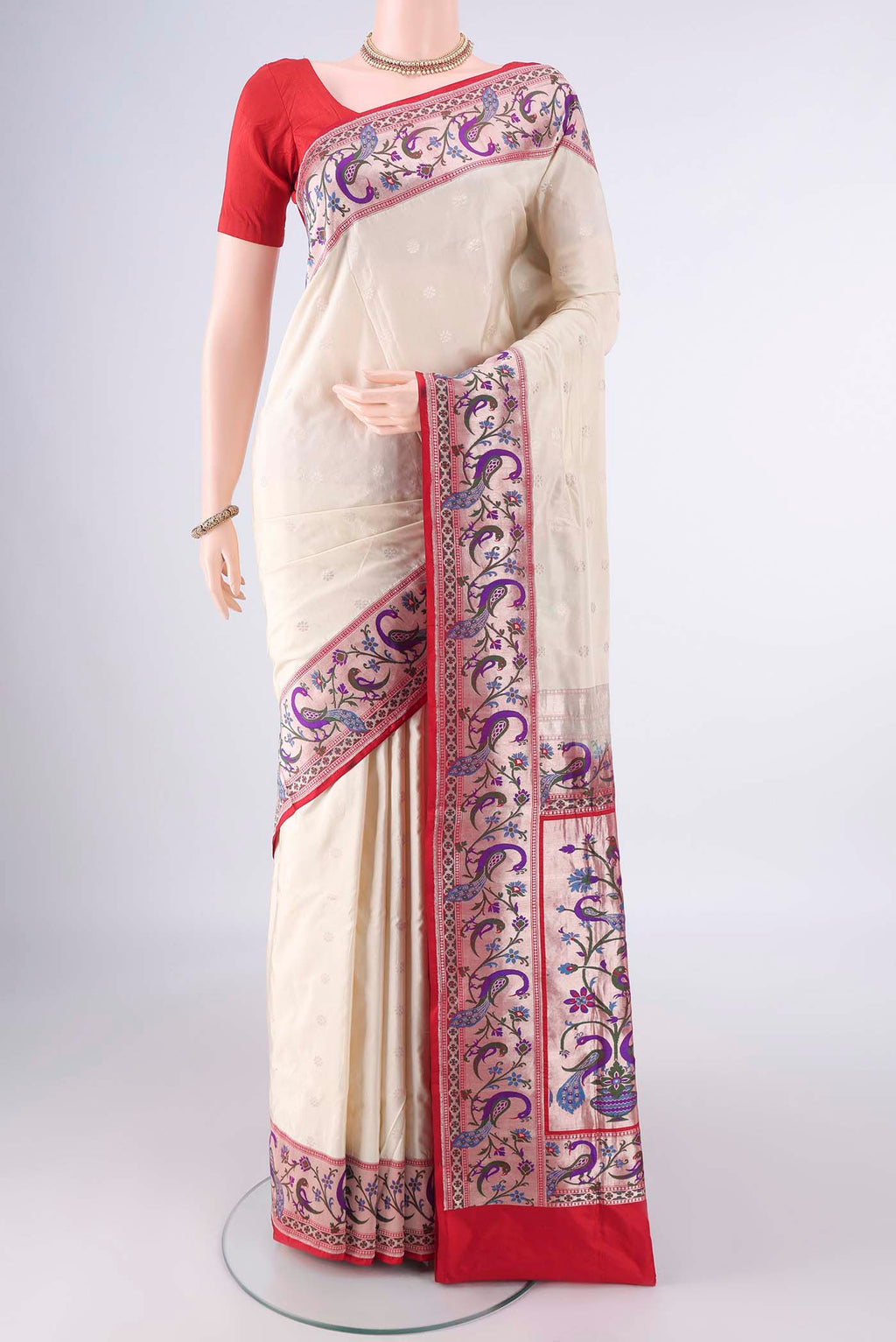 Pure Silk Cream Banarasi Saree with Zari Butta on the body and Zari Border.  displayed on a mannequin