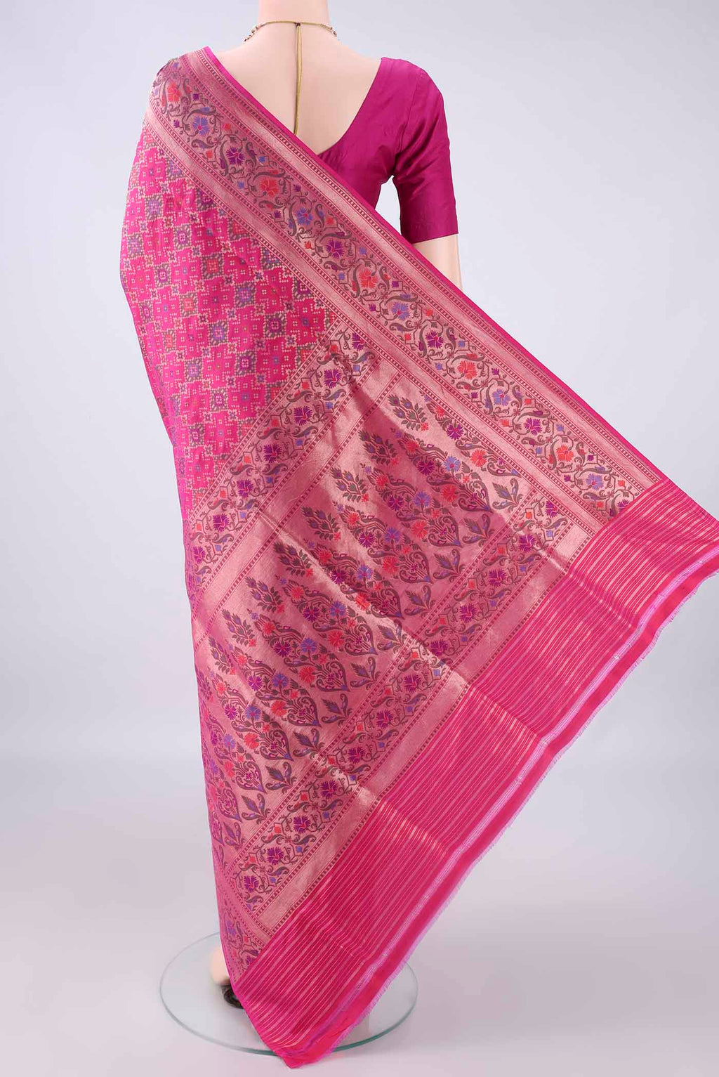 Flat view of Pure Silk Rani Pink Banarasi Saree with Zari Brocade on the body and Zari Border. 