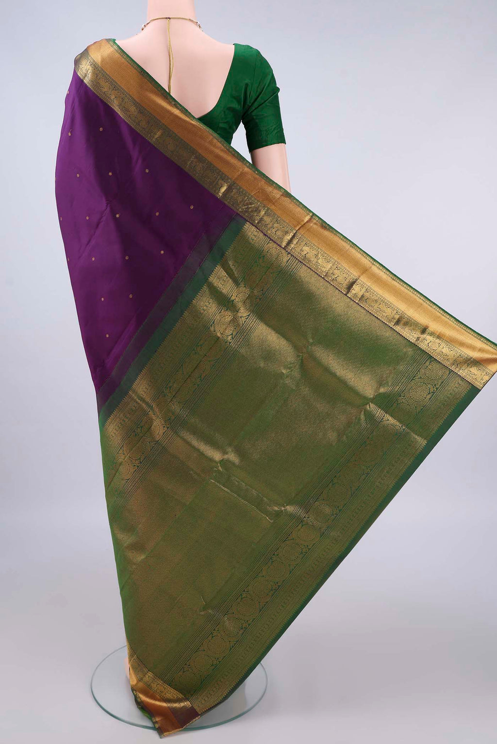 Flat view of Pure Silk Purple Kanchipuram Saree with Zari Butta on the body and Zari Border. 