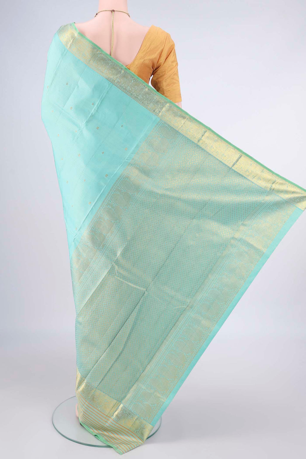 Flat view of Pure Silk Sea Green Kanjivaram Saree with Zari Butta on the body and Zari Border. 