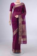 Magenta Maheshwari Cotton Saree with Zari Butta on the body and Zari Border.  displayed on a mannequin