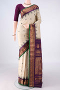 Pure Silk Off White Gadwal Saree with Thread Butta on the body and Zari Border.  displayed on a mannequin
