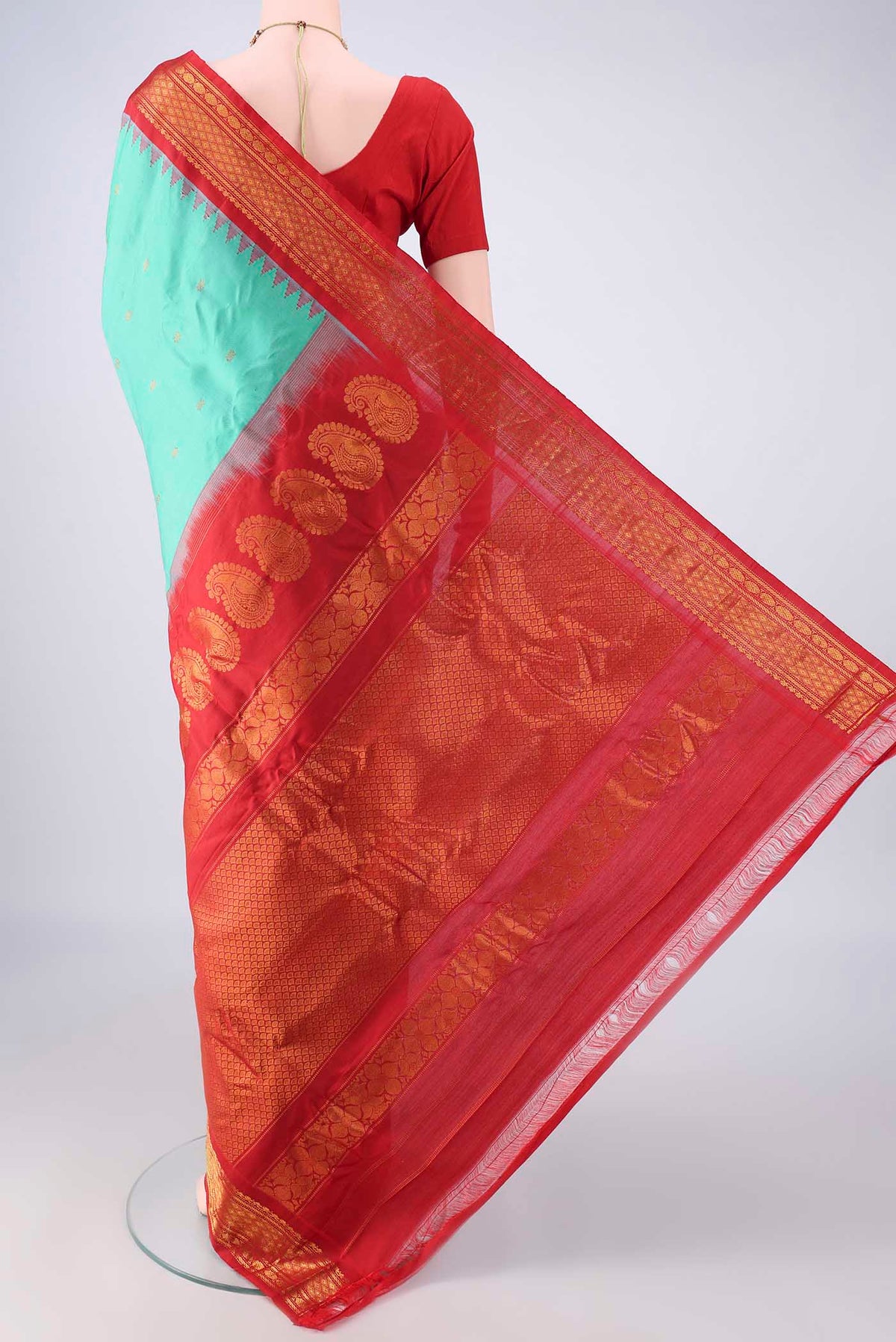Flat view of Pure Silk Sea Green Gadwal Saree with Zari Butta on the body and Zari Border. 