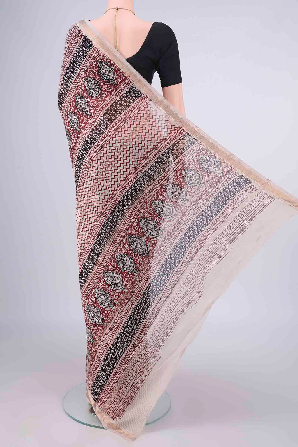 Flat view of Black Maheshwari Cotton Saree with Printed design on the body and Zari Border. 