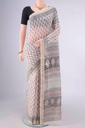Off White Maheshwari Cotton Saree with Printed design on the body and Zari Border.  displayed on a mannequin