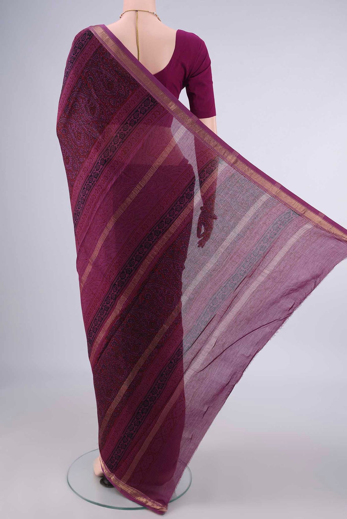 Flat view of Mauve Maheshwari Cotton Saree with Printed design on the body and Zari Border. 