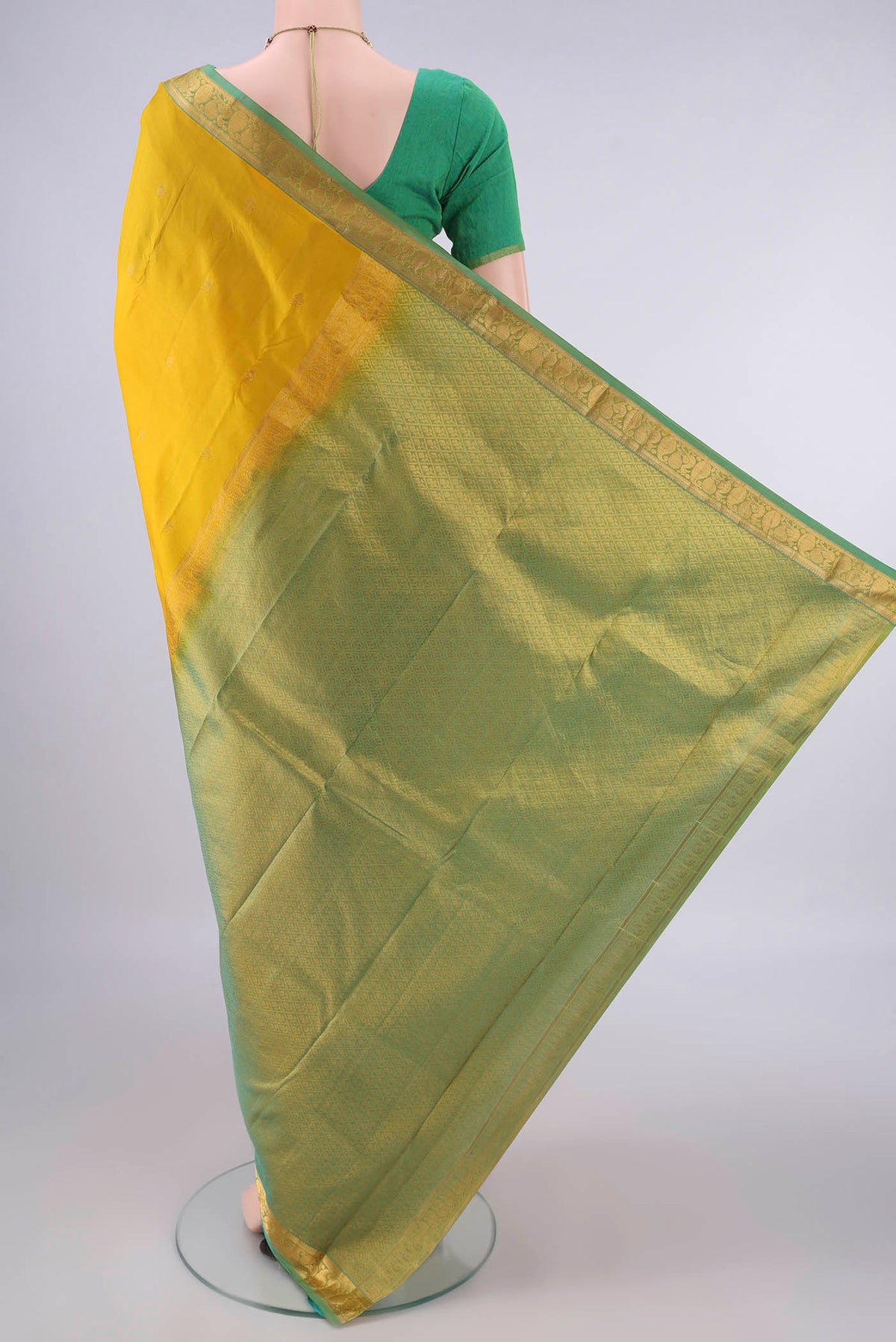 Flat view of Pure Silk Yellow Kanjivaram Saree with Zari Butta on the body and Zari Border. 