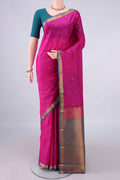 Pure Silk Rani Pink Kanjivaram Saree with Zari Butta on the body and Ganga Jamuna Border.  displayed on a mannequin