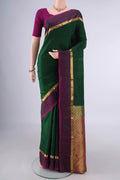 Pure Silk Bottle Green Kanjivaram Saree with Jacquard design on the body and Zari Border.  displayed on a mannequin