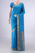 Pure Silk Blue Kanchipuram Saree with Zari Butta on the body and Zari Border.  displayed on a mannequin