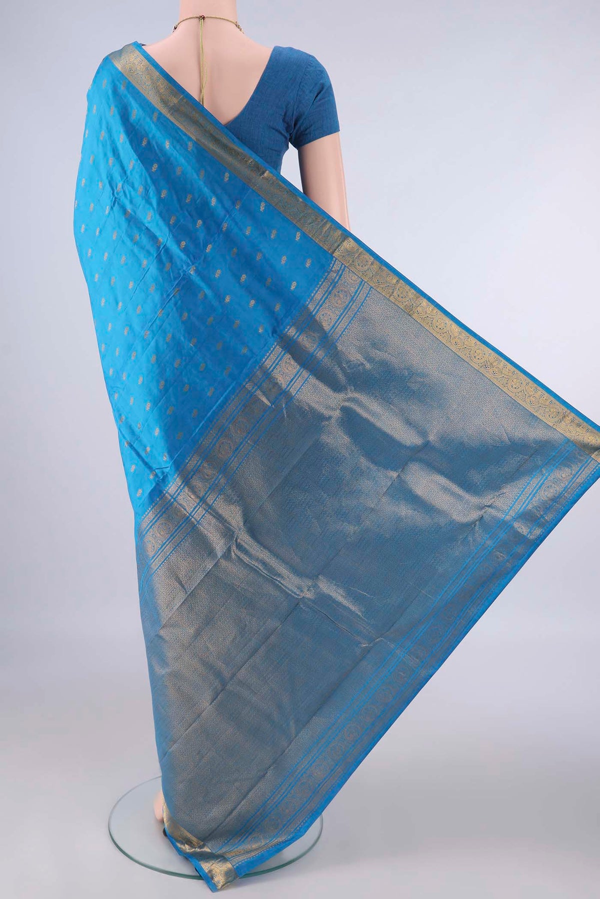 Flat view of Pure Silk Blue Kanchipuram Saree with Zari Butta on the body and Zari Border. 