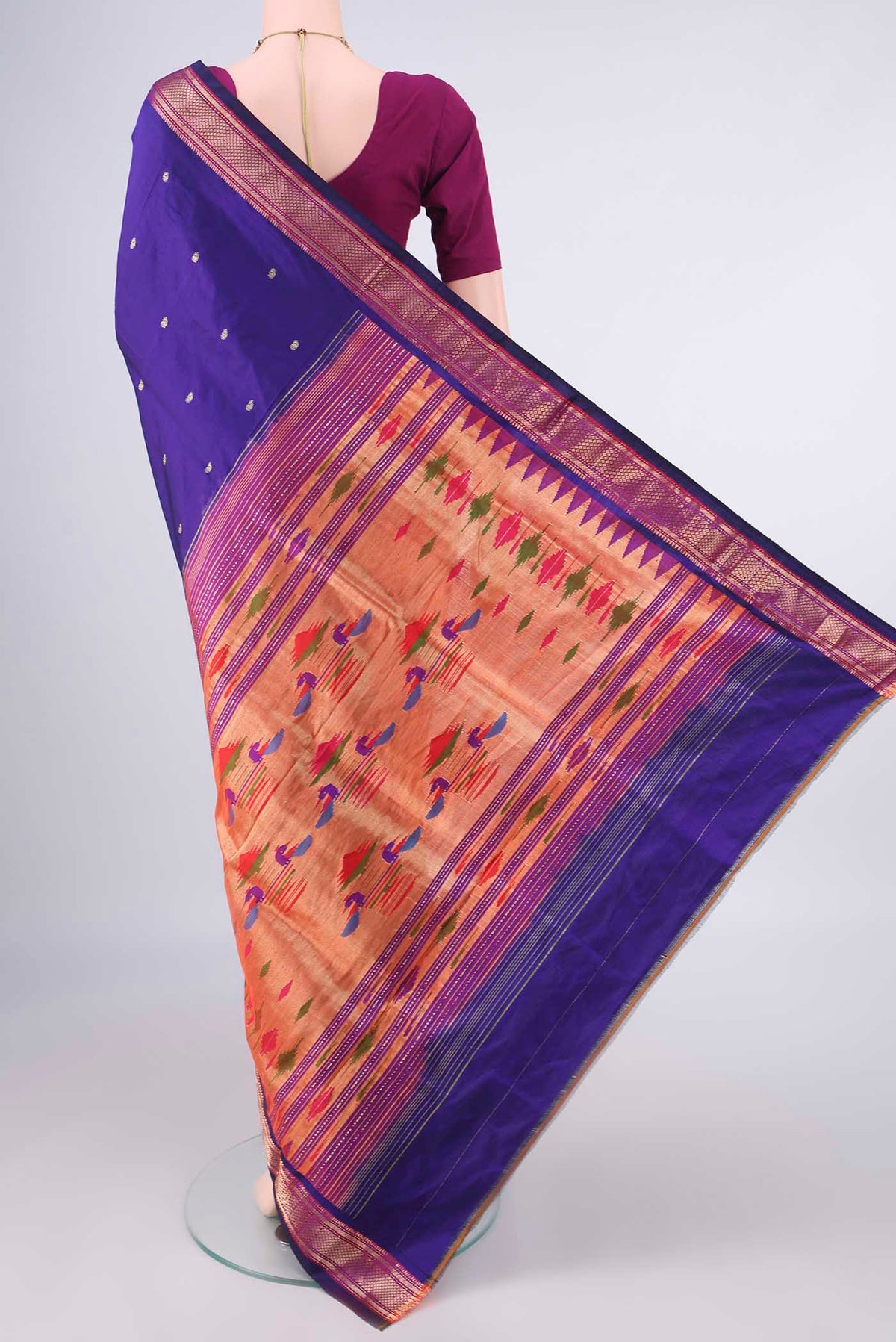 Flat view of Pure Silk Purple Paithani Saree with Zari Butta on the body and Zari Border. 