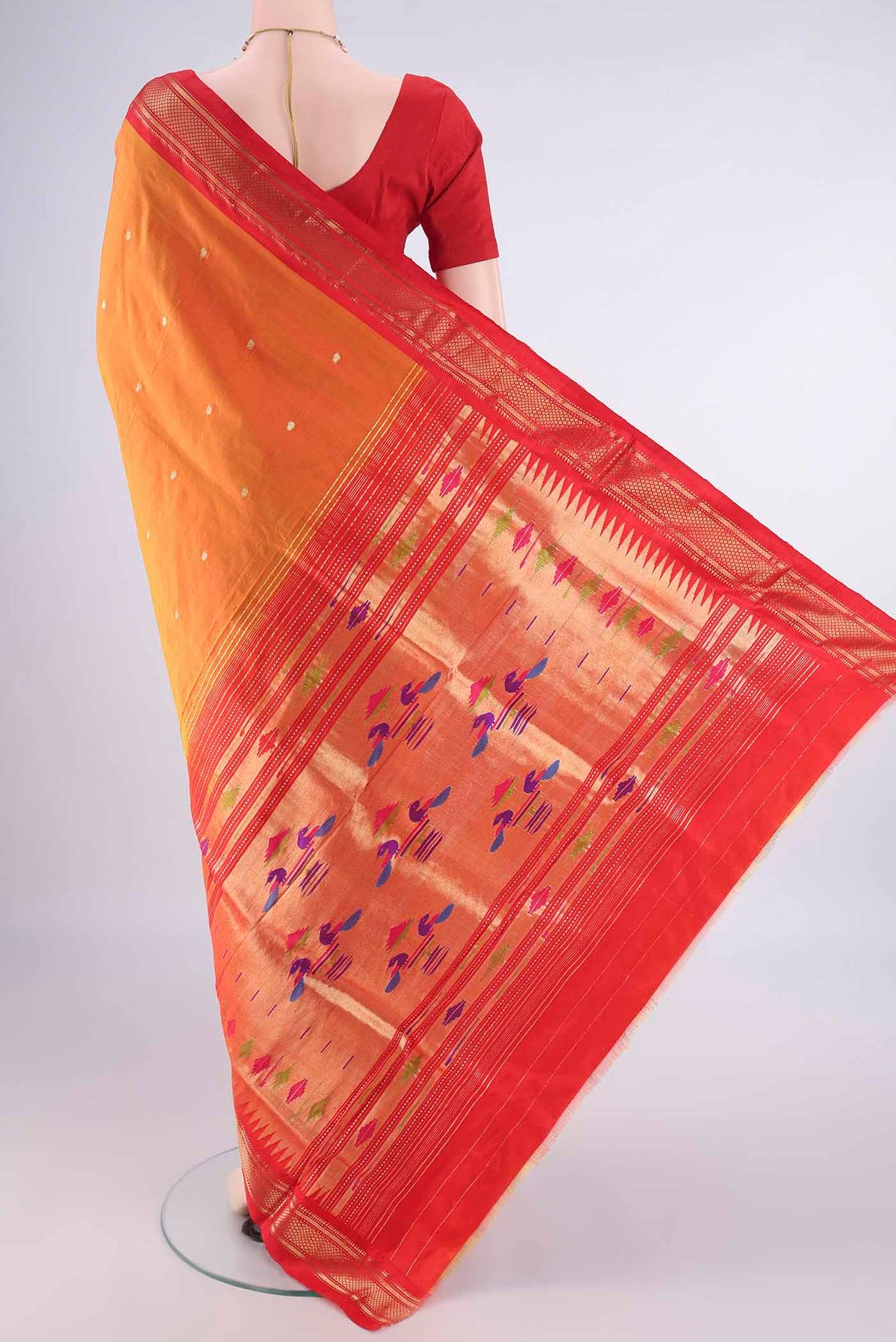 Flat view of Pure Silk Brick Orange Paithani Saree with Zari Butta on the body and Zari Border. 