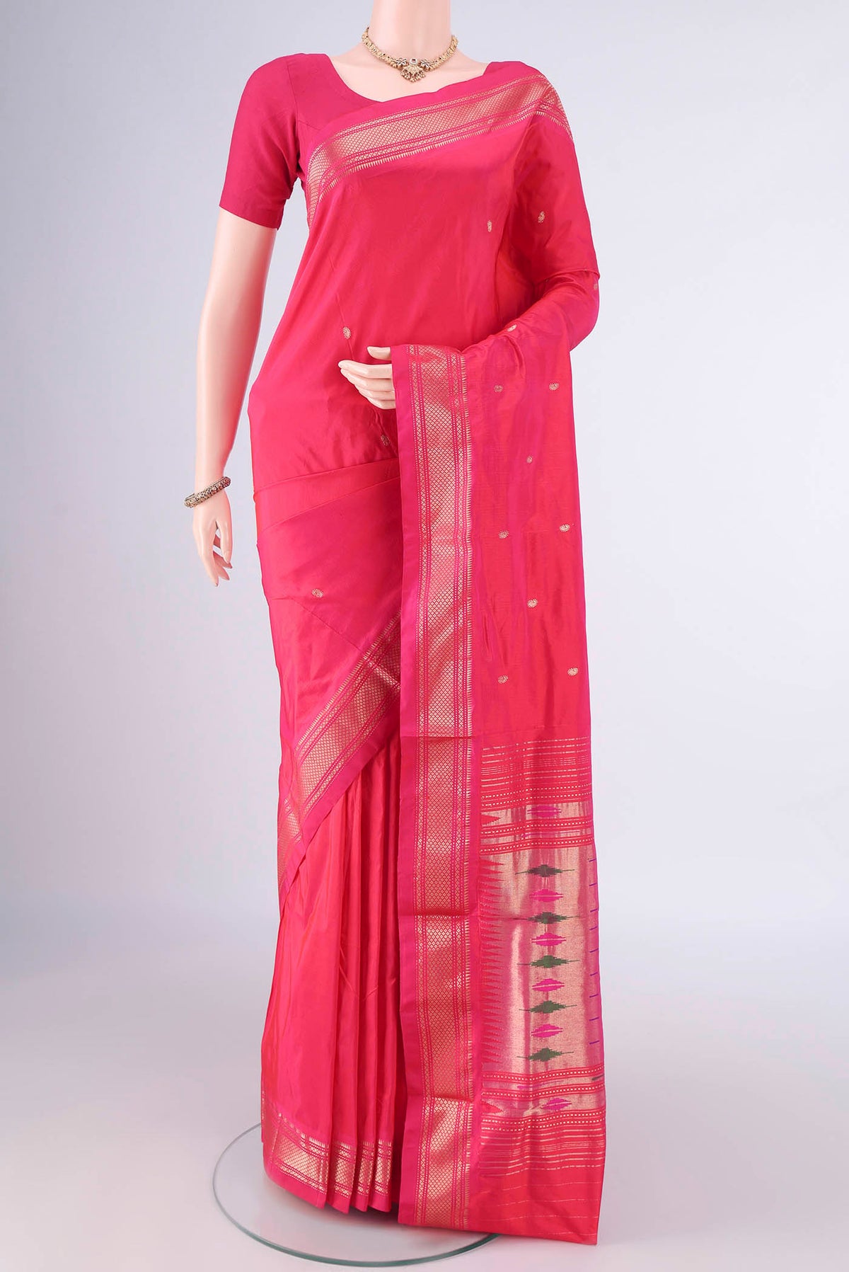 Pure Silk Pink Paithani Saree with Zari Butta on the body and Zari Border.  displayed on a mannequin