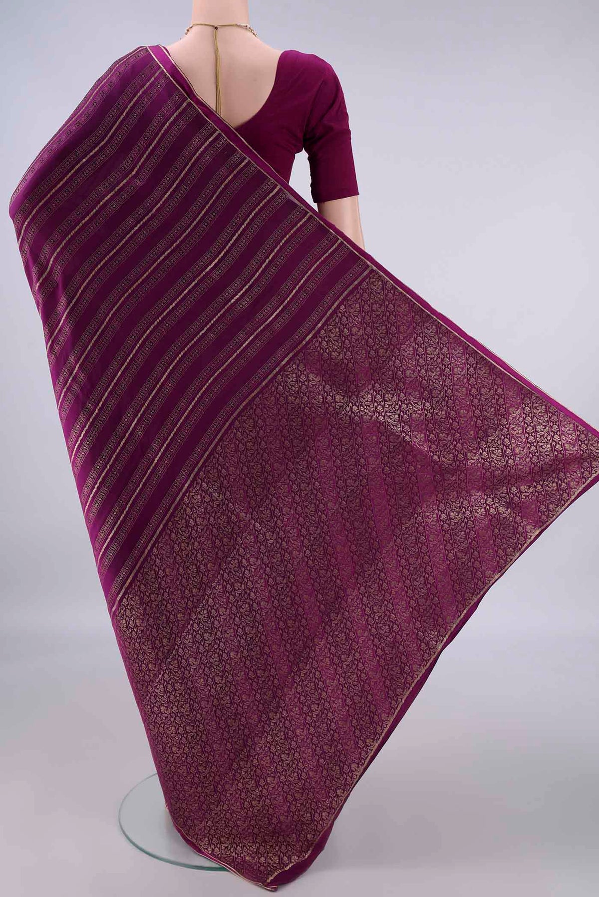 Flat view of Magenta Mysore Crepe Saree with Stripes on the body and Zari Border. 