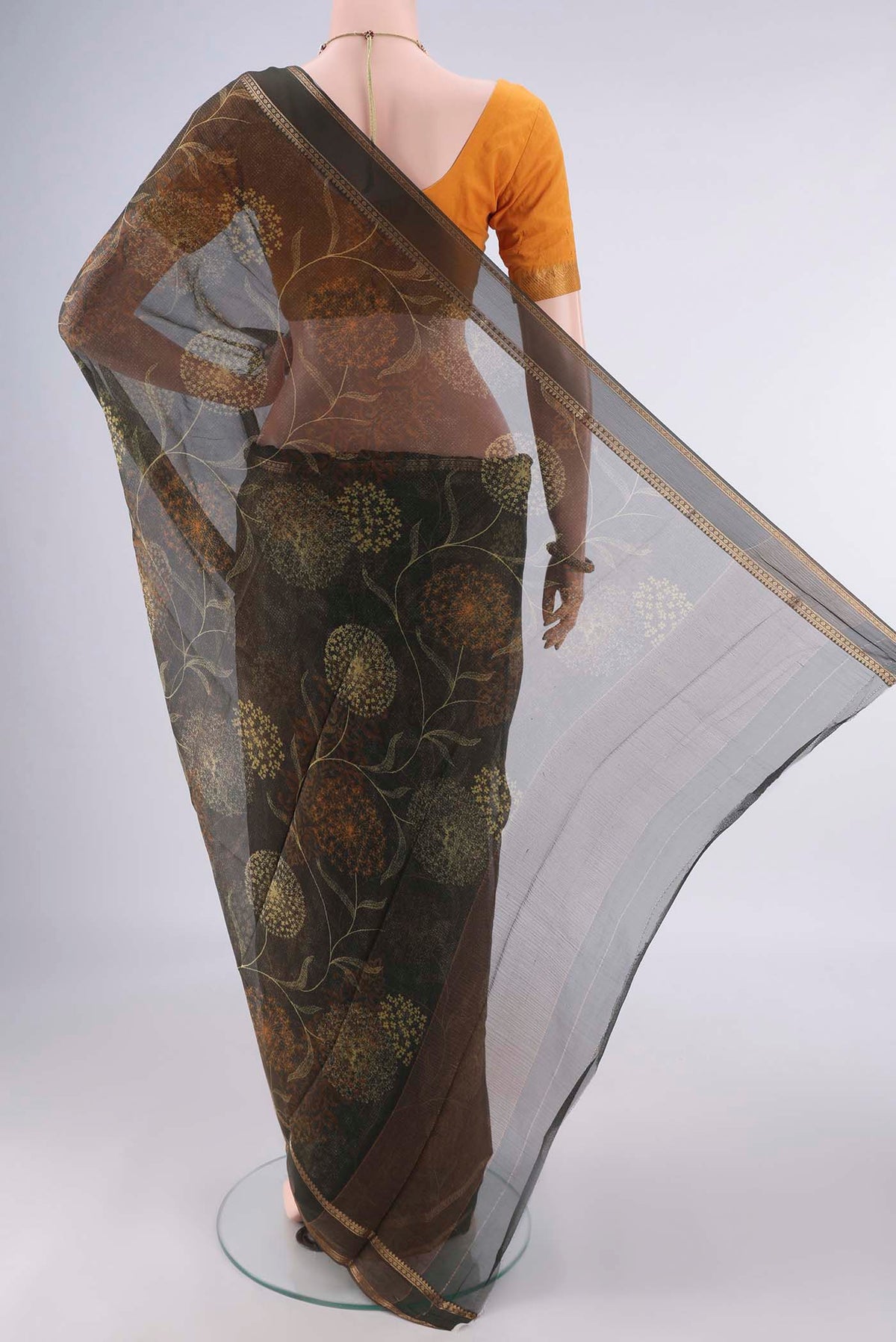 Flat view of Olive Green Mysore Chiffon Saree with Printed design on the body and Zari Border. 
