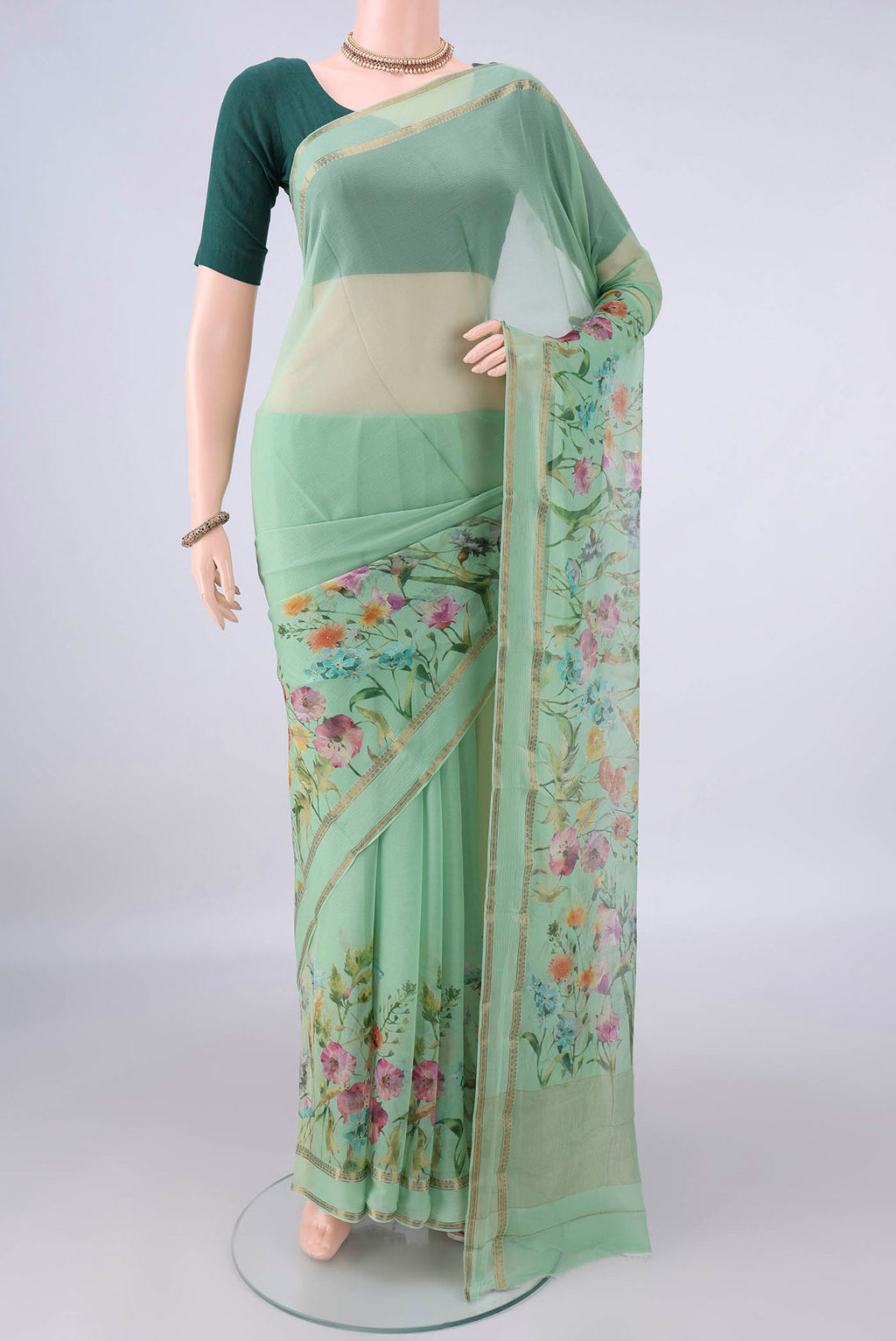 Light Green Mysore Chiffon Saree with Plain Body and Zari Border.  displayed on a mannequin