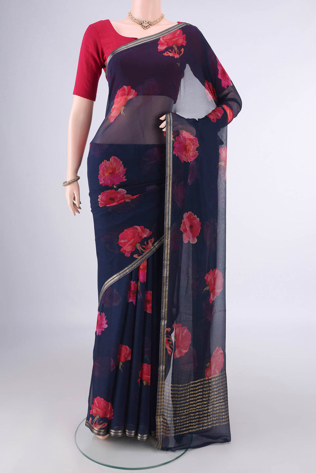 Navy Blue Mysore Chiffon Saree with Printed design on the body and Zari Border.  displayed on a mannequin