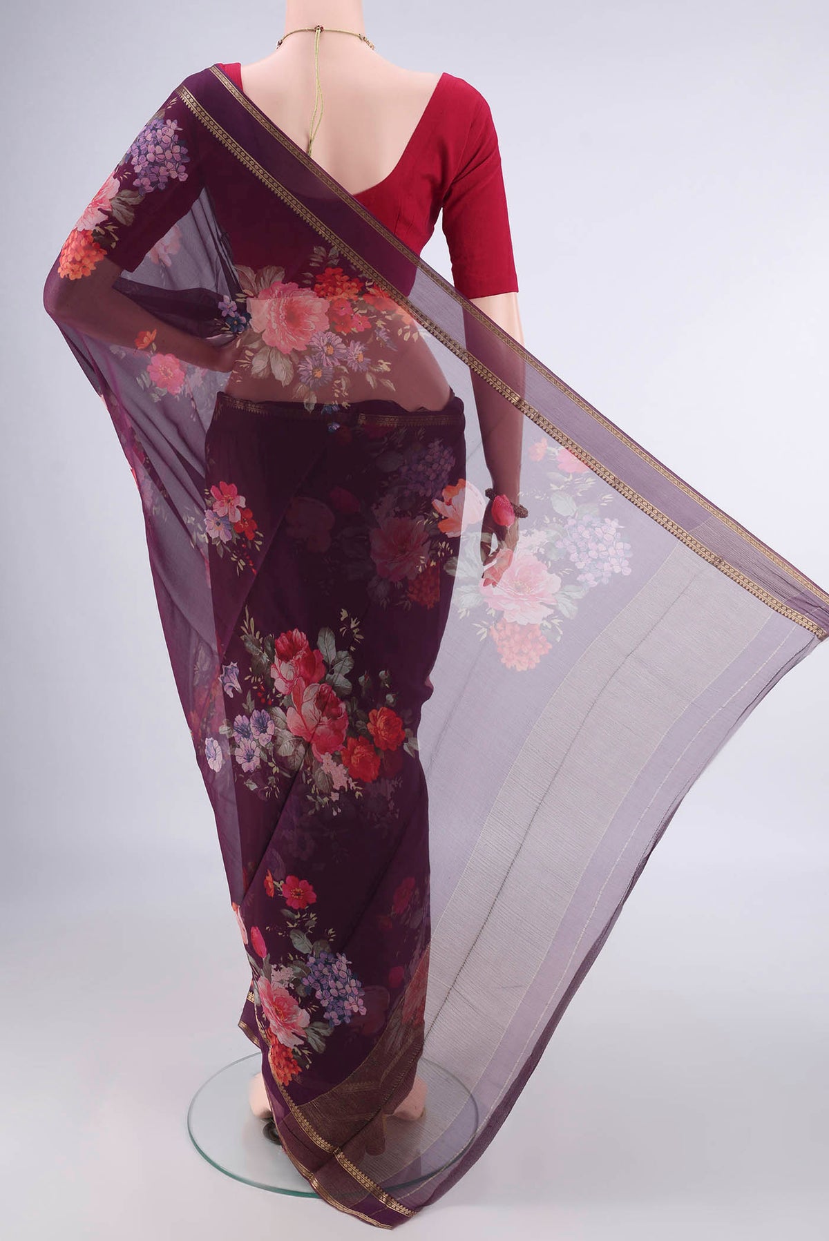 Flat view of Burgundy Mysore Chiffon Saree with Printed design on the body and Zari Border. 